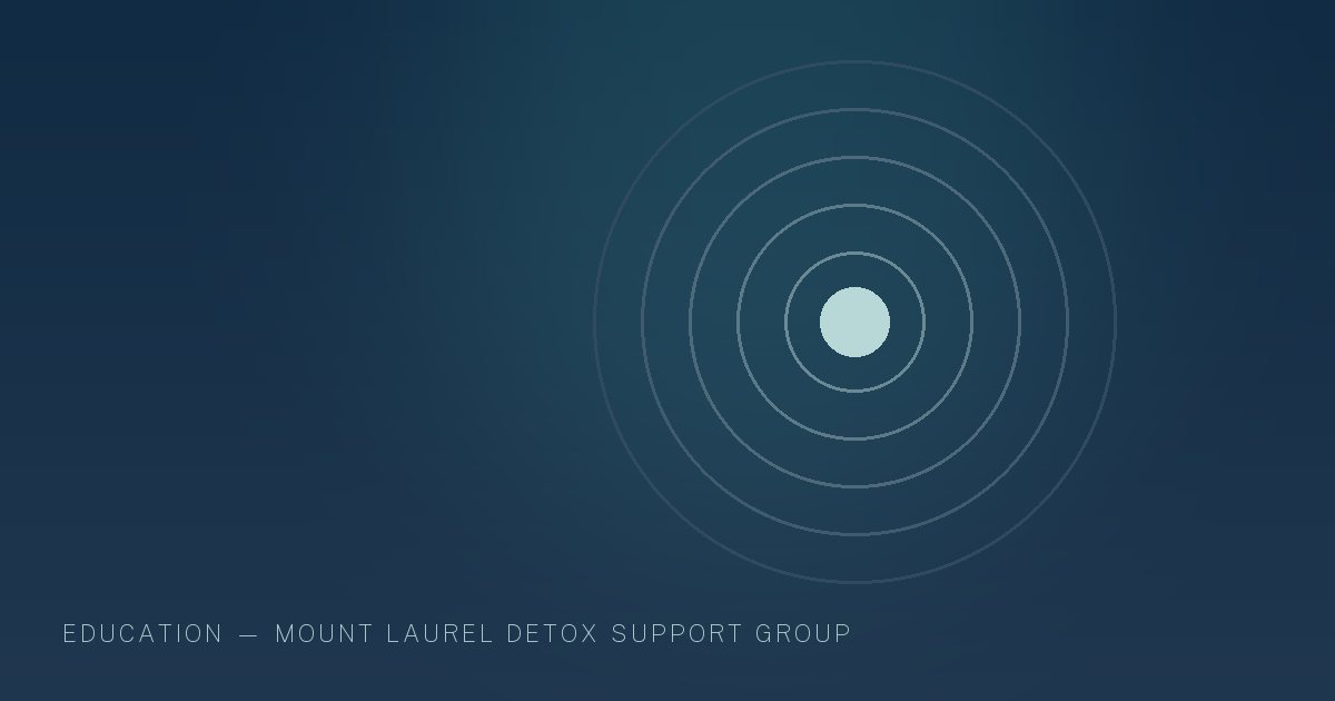 Illustration in the site's navy and teal palette showing a steady beacon of light inside a calm dark field, marking this guide to Signs of Alcohol Addiction.
